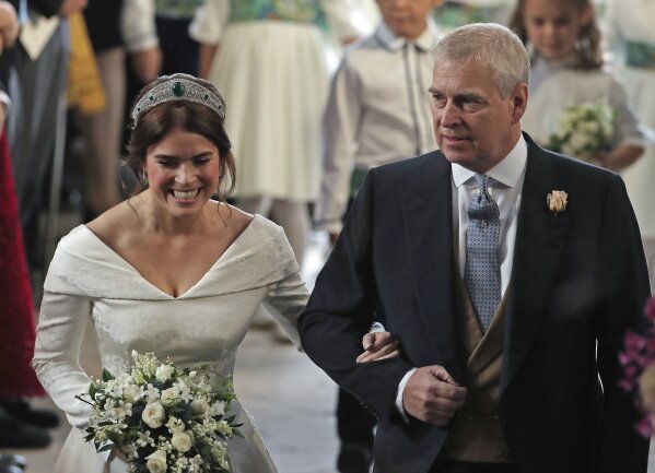 The Latest British designers made Eugenie s wedding dress AP News